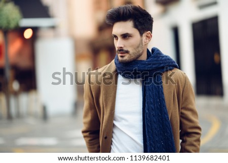 Similar – Young man wearing winter clothes in the street.