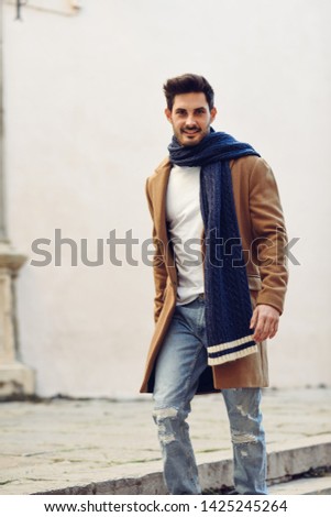 Similar – Young man wearing winter clothes in the street.