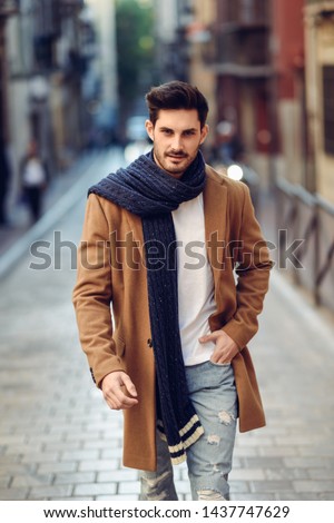 Similar – Young man wearing winter clothes in the street.