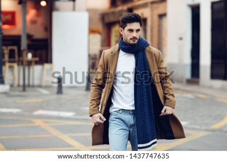 Similar – Young man wearing winter clothes in the street.