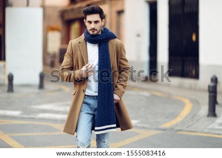 Similar – Young man wearing winter clothes in the street.