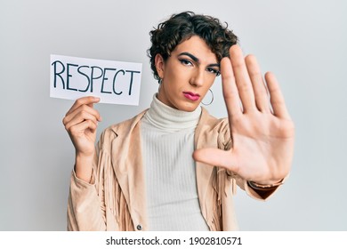 Young Man Wearing Woman Make Up And Woman Clothes Holding Respect Banner With Open Hand Doing Stop Sign With Serious And Confident Expression, Defense Gesture 