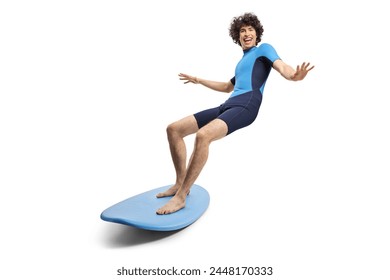 Young man in a wetsuit riding a surfboard isolated on white background - Powered by Shutterstock