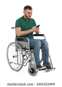 Young Man In Wheelchair With Mobile Phone Isolated On White