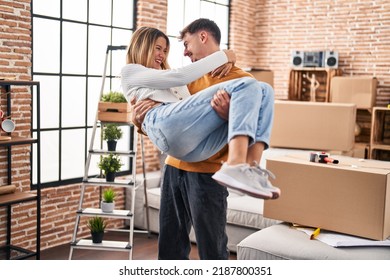 Young Man And Woman Couple Smiling Confident Hugging Each Other At New Home