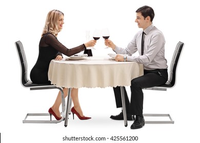 Young Man And Woman Drinking Red Wine On A Romantic Date Isolated On White Background