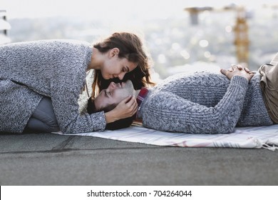 Young Man And Woman Embrace Outdoors On Autumn Sunset. Love And Relationship Concept