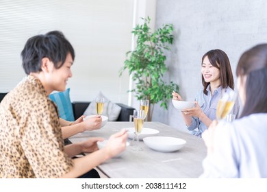 Young Man And Woman Having Dinner Together