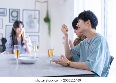 Young Man And Woman Having Dinner Together