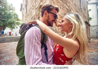 Young Man And Woman Kissing On The Streets