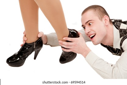 Young Man With Woman Leg In High Heels In Front Of Him Holding