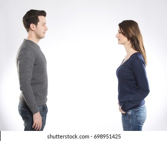 A young man and a woman looking each other