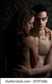 Young man and woman are standing naked together