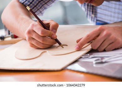 Young man in woodworking hobby concept - Shutterstock ID 1064342279
