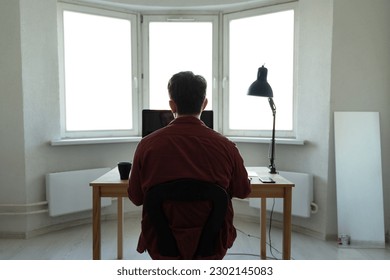 Young man working at the computer. Distance working, online education, shoping, resting, freelance