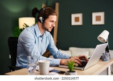 Young man working as customer support in the office - Shutterstock ID 2250114577