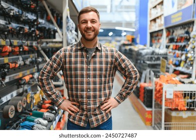 Young man working in hardware store. - Powered by Shutterstock