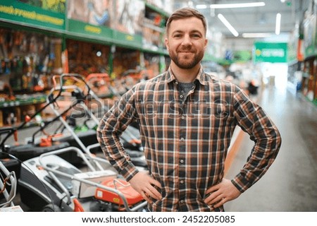 Young man working in hardware store.