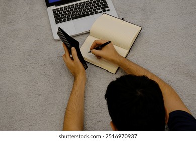 A young man working at home. remote working on computer. Businnes life. New worklife. - Powered by Shutterstock