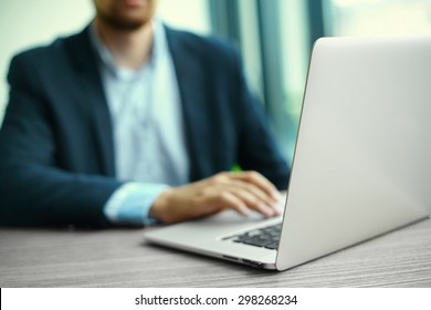 Young Man Working With Laptop, Man's Hands On Notebook Computer, Business Person At Workplace