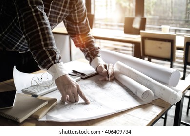 Young Man Working On His Plane Project At Site Construction Work.
