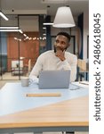 Young man working on laptop in office