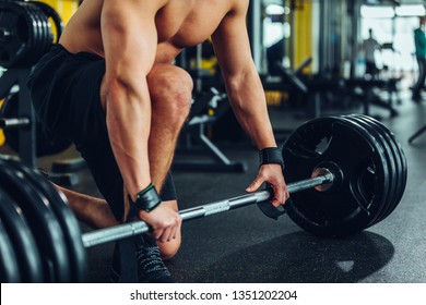 Young man working out at the gym - Shutterstock ID 1351202204