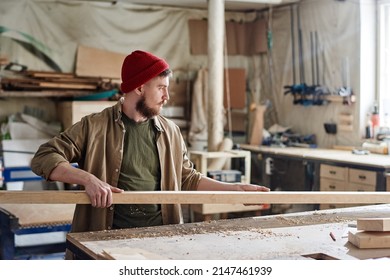 Young Man Working In Woodshop