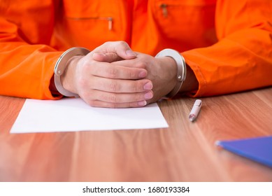 Young Man Writing Letter In Provisional Detention