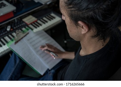 Young Man Writing Music During Quarantine. 