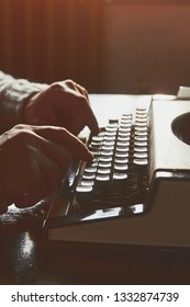 Young Man Writing On Old Typewriter.