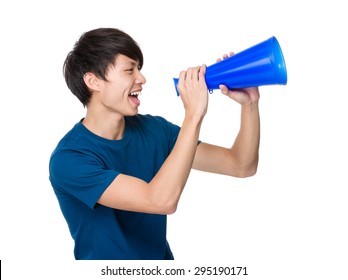 Young man yell with loudspeaker