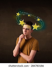Young man with yellow stars circleing around his head illustration  - Shutterstock ID 284783186