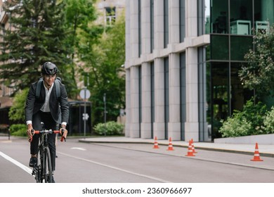 Young manager comuting to the office by electic scooter
