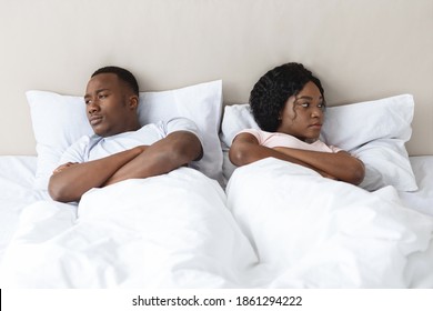 Young Married African American Couple After Fight In Bedroom, Sad Man And Woman Laying In Bed Apar. Upset Black Man And Woman Having Fight, Thinking About Divorce Or Breaking Up, Home Interior