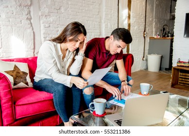 Young Married Couple With Finance Problems And Emotional Stress 