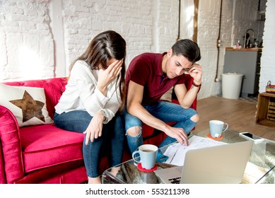 Young Married Couple With Finance Problems And Emotional Stress 