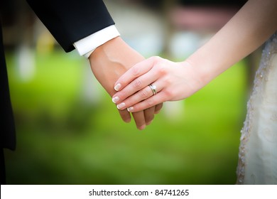 Young Married Couple Holding Hands, Ceremony Wedding Day