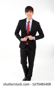 Young Mart Handsome Asian Man Business Office Wearing Suit Tie On White Background Walk Forward 