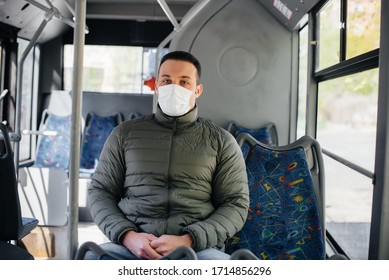 A Young Masked Man Uses Public Transport Alone During A Pandemic. Protection And Prevention Covid 19