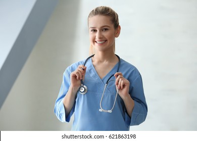 Young Medical Assistant With Stethoscope In Clinic