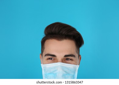 Young Medical Student With Face Mask On Color Background, Closeup