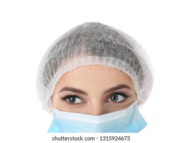 Young Medical Student With Face Mask And Surgical Cap On White Background, Closeup