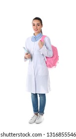 Young Medical Student With Notebooks And Backpack On White Background