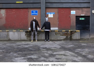 Young Men Dressed In Horse And Rabbit Mask Couple