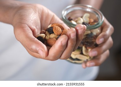 Young Men Eating Mixed Nut 