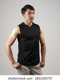 Young Men In Empty Black Tanktop, Stylish And Posing Like Famous T-shirt Models. Men's T-shirt Template And Mockup Design For Print.