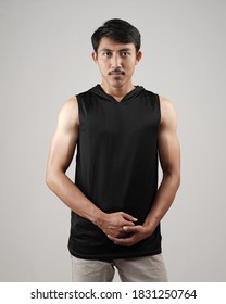 Young Men In Empty Black Tanktop, Stylish And Posing Like Famous T-shirt Models. Men's T-shirt Template And Mockup Design For Print.