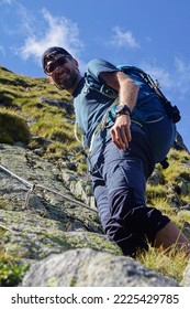 Young Men Hiking In The Tatra Mountains, Slovakia