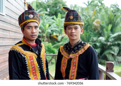 Young Men From Indigenous People Of Sabah Borneo In East Malaysia In Traditional Attire During Musical And Dance Festival. 